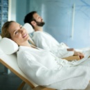 Handsome man and beautiful woman relaxing in spa