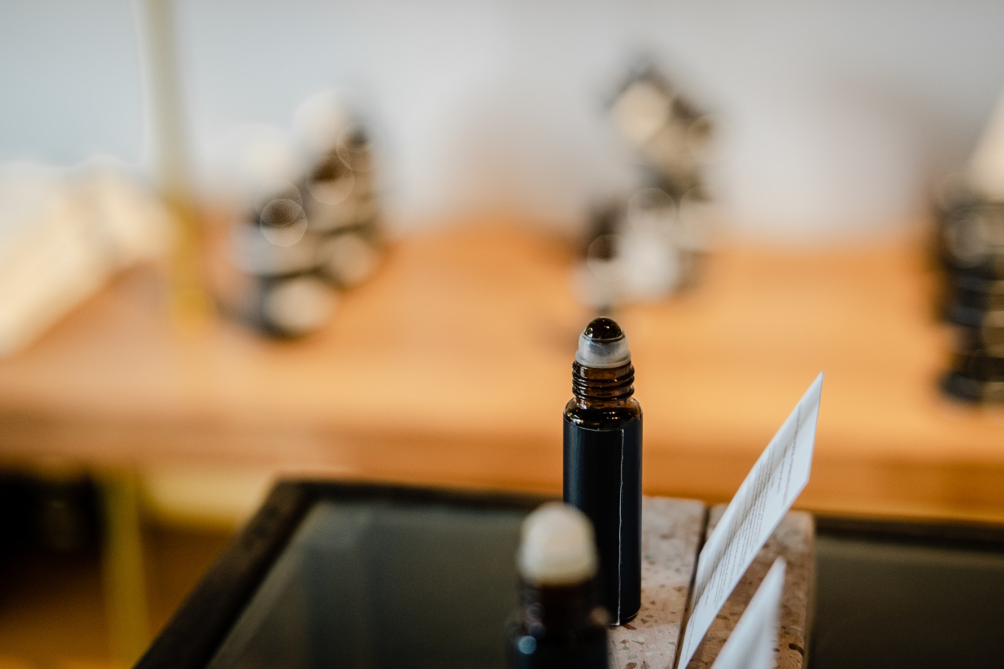 Roll on perfume in dark brown bottle