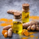 Turmeric essential oil, orange root and powder, beauty and spa