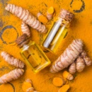 Turmeric essential oil, orange root and powder, beauty and spa
